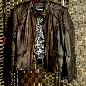 Beautiful leather jacket with chain- link detail around collar.